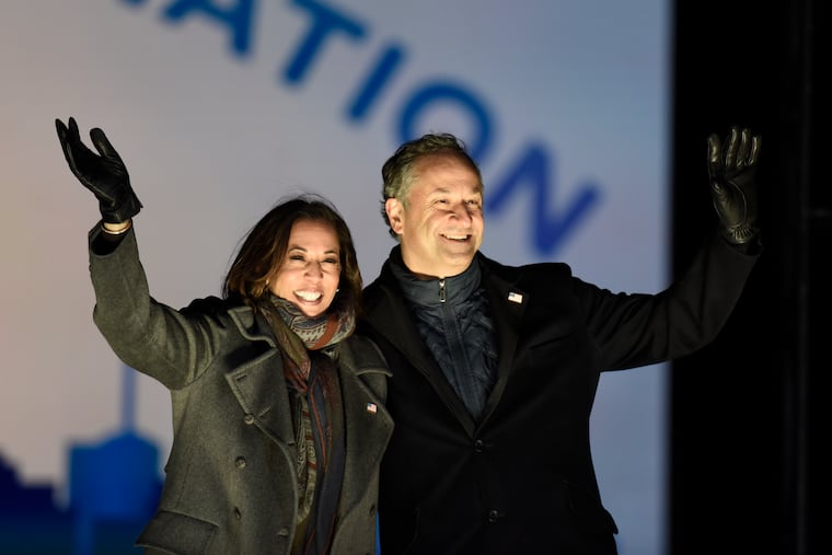 Democratic vice presidential candidate Sen. Kamala Harris, D-Calif., and her husband Doug Emhoff take the stage during a drive-in get out the vote rally, Monday, Nov. 2, 2020, in Philadelphia.