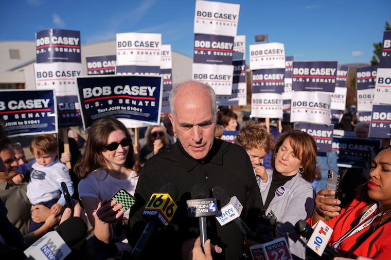 Sen. Bob Casey stops to speak to members of the media before voting on Nov. 5 in Scranton.