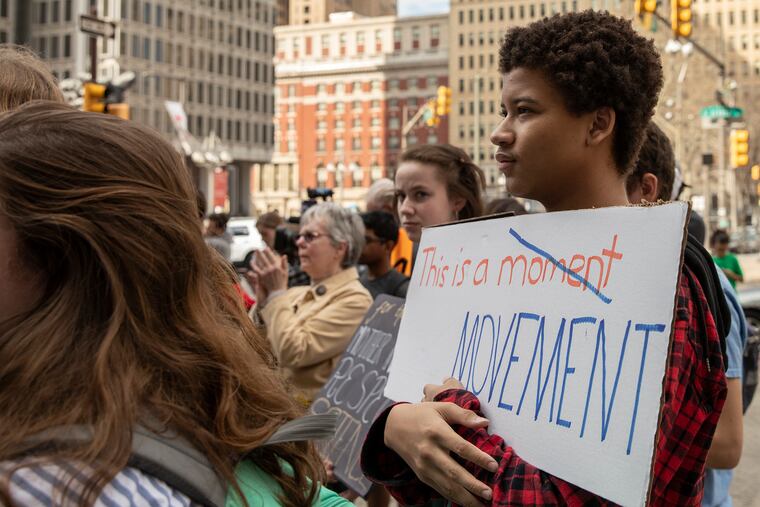 Nick Jacobs, 17, listens to speeches during a global climate strike at City Hall in Philadelphia on Friday afternoon, March 15, 2019. Students from around the Philadelphia region along with people of all ages came together for the global movement.