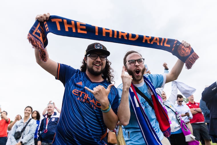 New York City FC fans react to the announcement that East Rutherford, N.J., will be a host city for the 2026 FIFA World Cup, during a selection watch part at Liberty State Park in Jersey City on June 16, 2022. One month before the 2026 World Cup, New Jersey moved to allow bars to stay open later during the tournament.