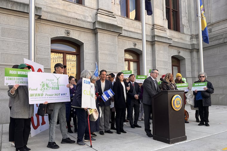 Patrick McDonnell, President and CEO of PennFuture, and Philadelphia Councilmember Jamie Gauthier speak at a lectern Thursday, at a rally in support of Pennsylvania joining the Regional Greenhouse Gas Initiative.