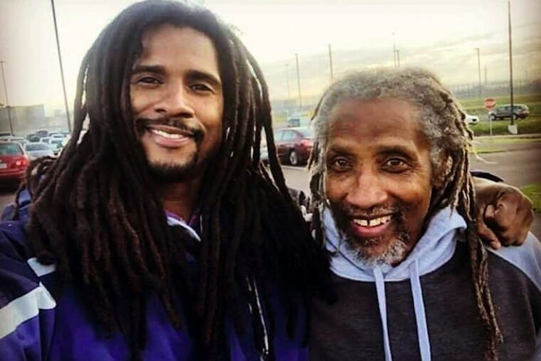 Michael Africa Jr., left, with his father, Michael Sr., after leaving Phoenix state prison.