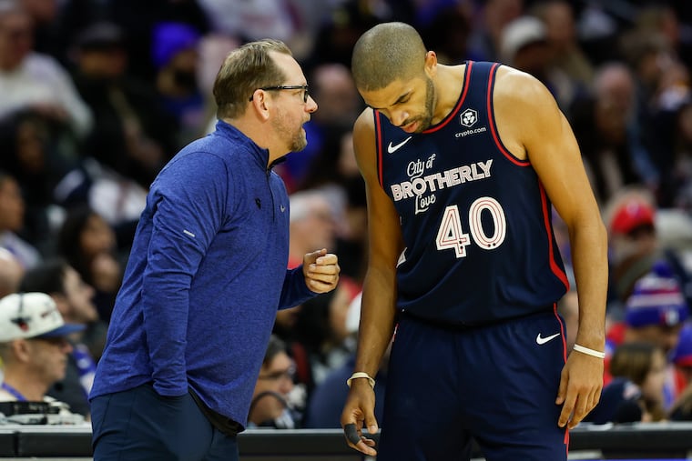 Sixers coach Nick Nurse talks to forward Nicolas Batum during the game against the Utah Jazz on Saturday.