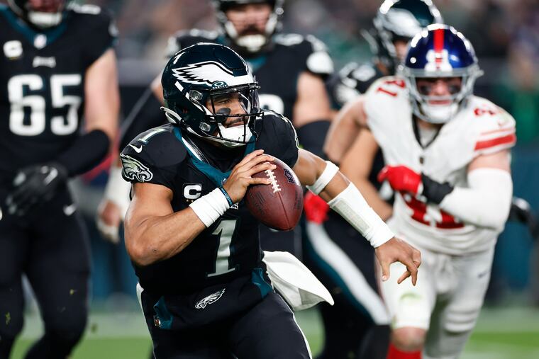 Eagles quarterback Jalen Hurts scrambles with the football against the New York Giants on Monday, December 25, 2023 in Philadelphia.