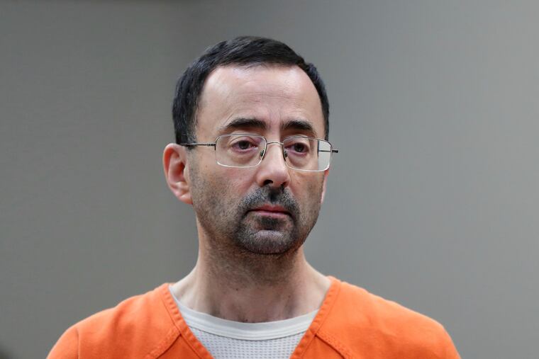 Disgraced former sports doctor Larry Nassar appears in court for a plea hearing on Nov. 22, 2017, in Lansing, Mich.