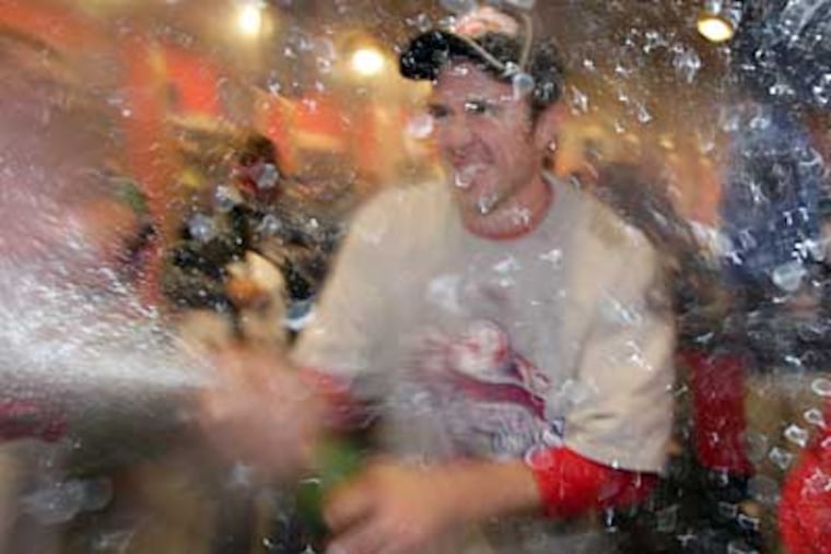 Chase Utley sprays champagne after the Phillies’ victory in the World Series. The brand he's brandishing, Domaine Ste. Michelle Brut, is also good for drinking. (YONG KIM / Staff Photographer)