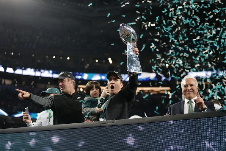 Eagles general manager Howie Roseman (center) in better days: hoisting the Lombardi Trophy following the Eagles' 31-33 victory over New England in Super Bowl LII.