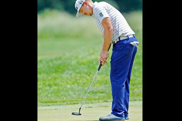 Hunter Mahon putts his golf ball on the 14th green during practice day at the 2013 U.S. Open at the Merion Golf Club East Course on Tuesday, June 11, 2013. ( Yong Kim / Staff Photographer )