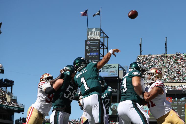 Jalen Hurts throws a pass against the 49ers in a 2021 game.