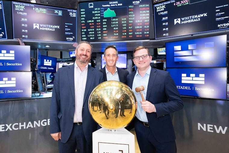 WhiteHawk Minerals Corp. executives "ring the bell" at the New York Stock Exchange taking the Philadelphia-based natural gas investment company public on June 9. Flanking CEO Dan Merz (center) are Jeffrey Slotterback (left), chief financial officer, and Matthew Heinlein, vice president and head of corporate strategy.