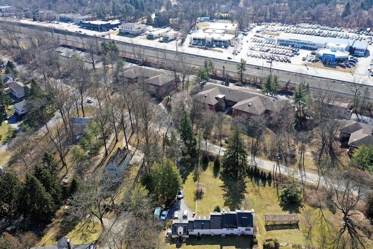The proposed site for the Solera assisted-living and memory-care complex (above the road and below the train tracks) sits across from a residential neighborhood, in which dozens of residents have banded together to oppose the plan.
