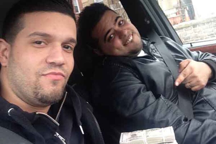 In this undated photo provided by the United States Attorney’s Office for the Southern District of New York, Elvis Rafael Rodriguez, left, and Emir Yasser Yeje, pose with bundles of cash allegedly stolen using bogus magnetic swipe cards at cash machines throughout New York. Prosecutors in New York on Thursday, May 9, 2013 said that they are members of worldwide gang of criminals who stole $45 million in hours by hacking into a database of prepaid debit cards and draining cash machines around the globe. An indictment unsealed Thursday accused U.S. cell ringleader Alberto Yusi Lajud-Pena and seven other New York suspects of withdrawing $2.8 million in cash from hacked accounts in less than a day. (AP Photos/U.S. Attorney’s Office for the Southern District of New York)