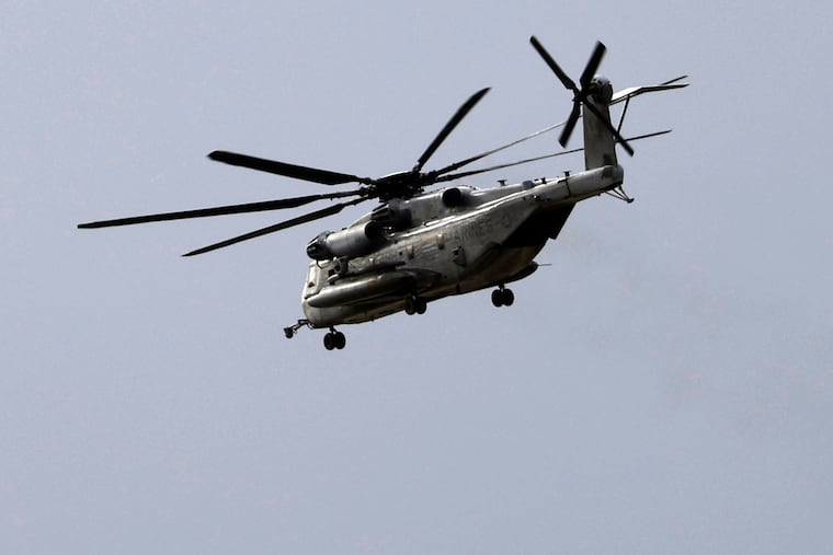 A Marine CH-53E Super Stallion helicopter flies during training in San Diego on Tuesday, Feb. 6, 2024. The military says five U.S. Marines aboard a helicopter, like the one pictured, that went down in the mountains outside of San Diego on Wednesday have been confirmed dead.