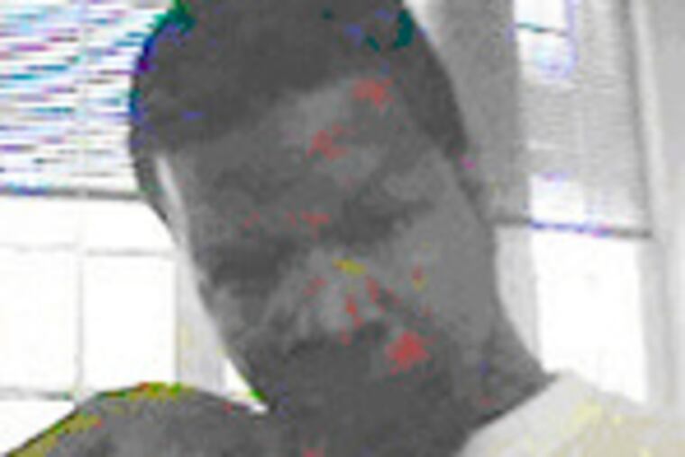 "Mike" (above) is wanted on beating, robbery and kidnapping charges.