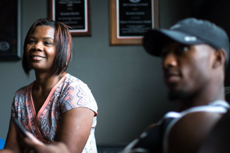 Lisa Boykin sits with her son Brandon
Boykin in the family home in Fayetteville, Ga. (Branden Camp /
For the Daily News)