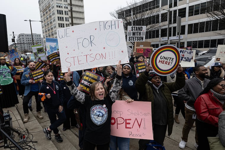 Students rally before a Philadelphia school board meeting outside of district headquarters on North Broad Street. They spoke out against a proposal to close some public schools.
