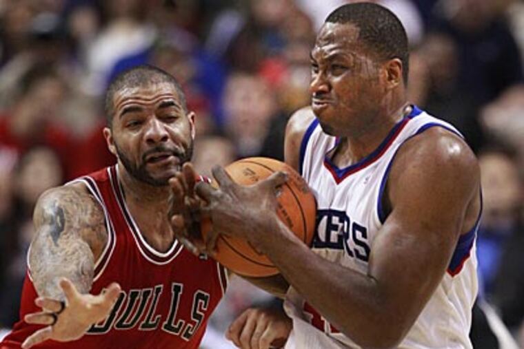 Sixers forward Elton Brand gets fouled by Bulls forward Carlos Boozer in the first quarter of Game 3. (Ron Cortes/Staff Photographer)