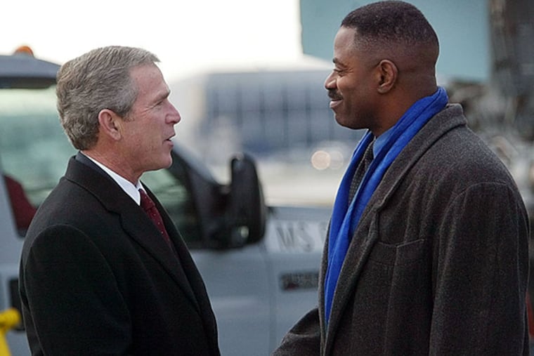FILE - Former Eagles linebacker and current WIP radio co-host Garry Cobb on Tuesday announced a congressional campaign. Back in 2002 he met with former president George W. Bush at Philadelphia International Airport. (Pablo Martinez Monsivais/AP file photo)