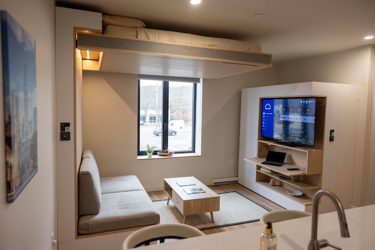 A studio apartment in the Flats on 100 has with a ORI bed that can be raised and lowered. It's controlled by phone.