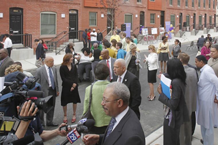 Among those on hand for the dedication of new housing on the 800 block of Markoe Street in the Mill Creek section of the city was U.S. Rep. Chaka Fattah, in foreground. (Akira Suwa / Staff Photographer)