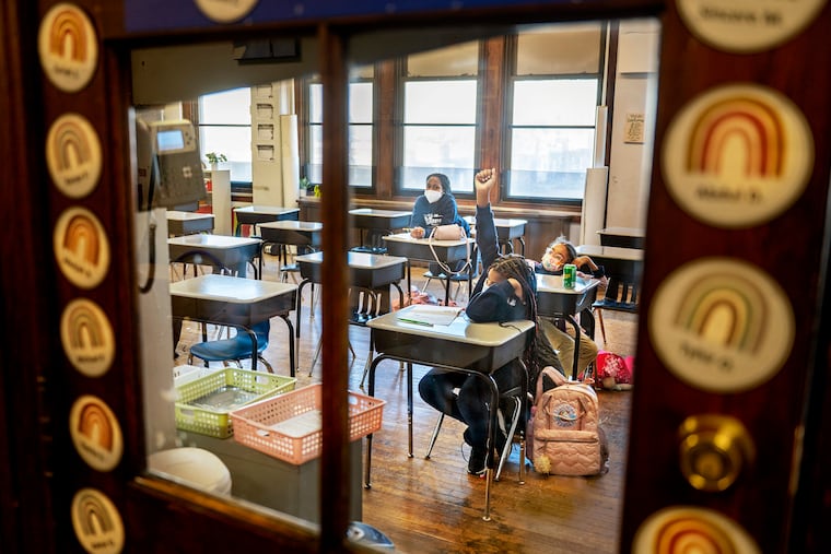 Students (from front to back) Jade Davis, 9, Londyn Serrano, 10, and Aja-nae Newton, 10, in an after-school program known as Black Girls Love Math at Mastery Charter School Mann Campus.