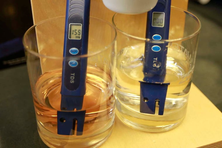 A ZeroWater demonstration shows its filter doing a better job of removing solubles from wine than a competing brand of filter, which left the wine pink.