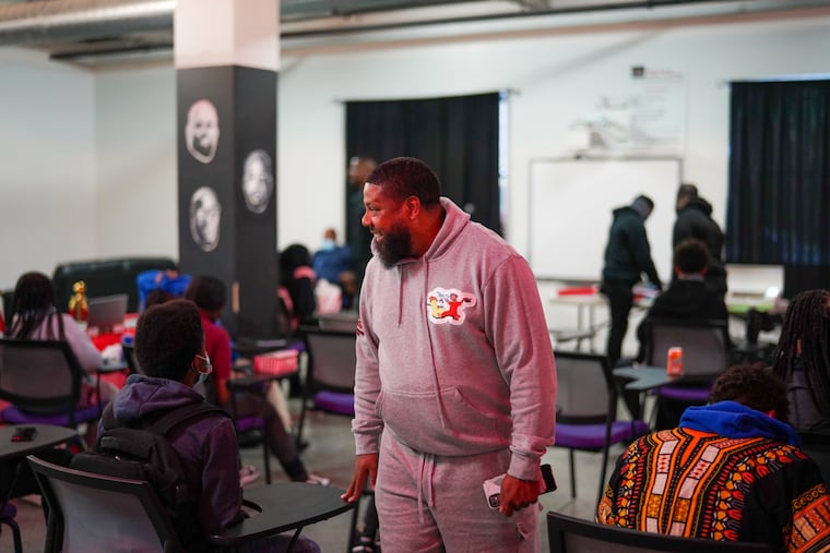 Ricky Duncan speaks with kids at the NoMo Foundation on North Broad Street.