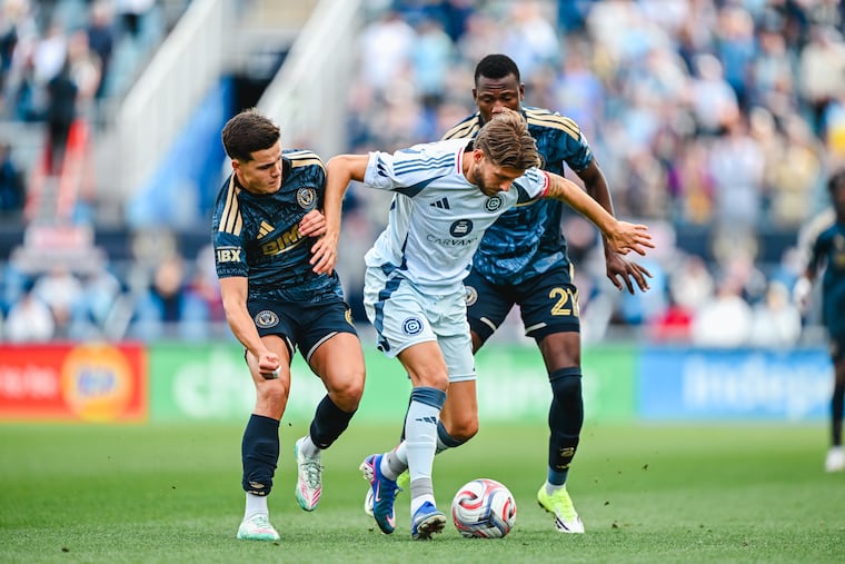 Chicago's Anton Salétros (center) battles with the Union's Cavan Sullivan (left) and Danley Jean Jacques during Saturday's MLS matchup at Subaru Park.