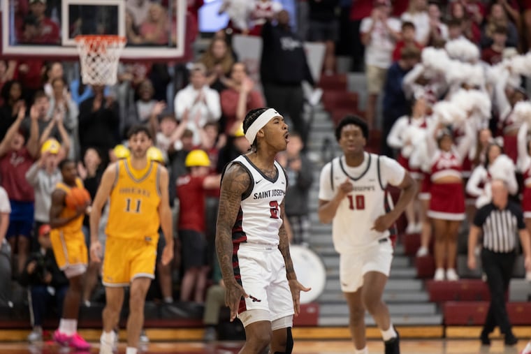 Deuce Jones II celebrates his 29 points to lead St. Joe’s past Drexel, 76-65, in the first Big 5 men’s game of the season on Saturday.