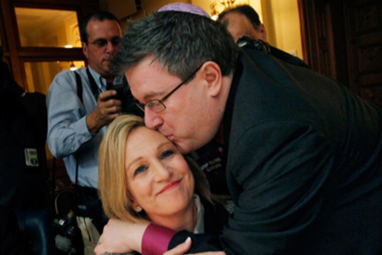 Assemblywoman Valerie Vainieri Huttle (D., Englewood) and Steven Goldstein of Garden State Equality celebrate the vote. (Mel Evans / AP)