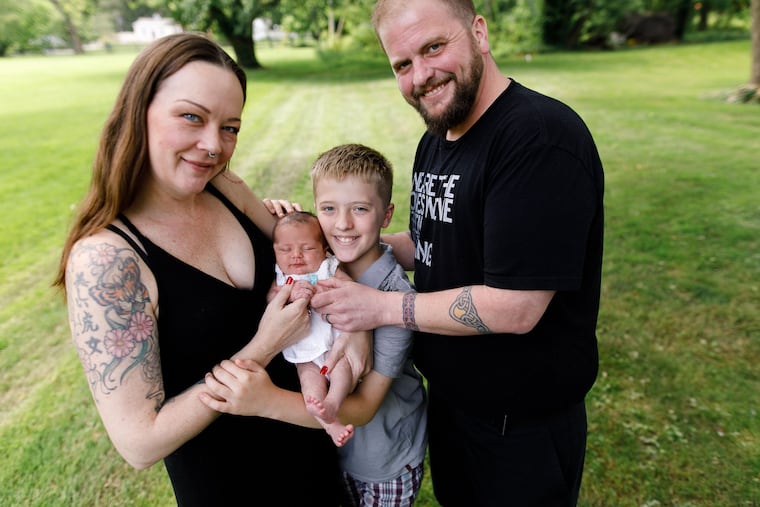 Heather and Simon with baby Marcella (Mars) and Patrick.