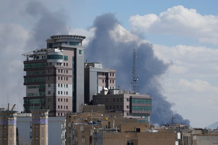 Smoke rises after a strike in Tehran, Iran, on Sunday.