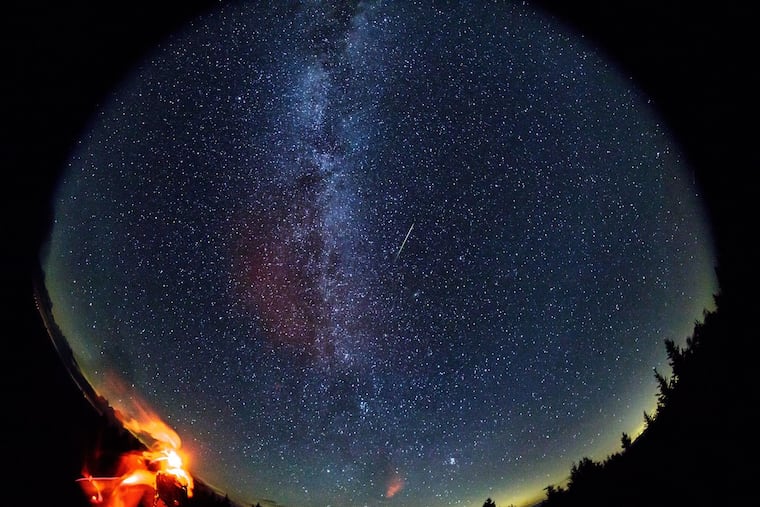 In this 30-second exposure taken with a circular fish-eye lens, a meteor streaks across the sky during the annual Perseid meteor in August 2016 in Spruce Knob, W. Va.
