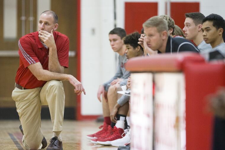 Chuck Guittar (left, kneeling) has resigned after 12 seasons as the Lenape boys' basketball coach.