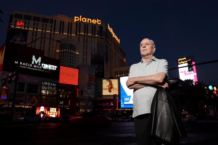 Jeff German, host of "Mobbed Up," poses with Planet Hollywood, formerly the Aladdin, in the background on the Strip in Las Vegas, Wednesday, June 2, 2021. Authorities say German, a Las Vegas investigative reporter has been stabbed to death outside his home and police are searching for a suspect. The Las Vegas Review-Journal says officers found journalist German dead with stab wounds around 10:30 a.m. Saturday, Sept. 3, 2022, after authorities received a 911 call.