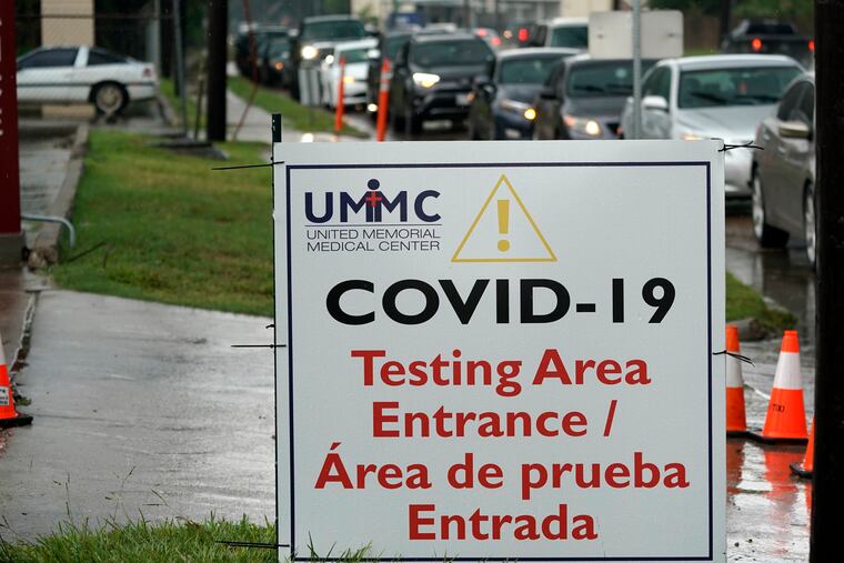 Cars are lined up at a United Memorial Medical Center COVID-19 testing site in Houston.
