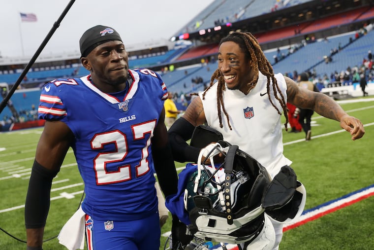 Buffalo Bills cornerback Tre'Davious White (27) talks with Eagles cornerback Ronald Darby, his teammate briefly in the spring and summer of 2017, after a game at New Era Field in Orchard Park, N.Y., on Sunday, Oct. 27, 2019. The Eagles won 31-13.