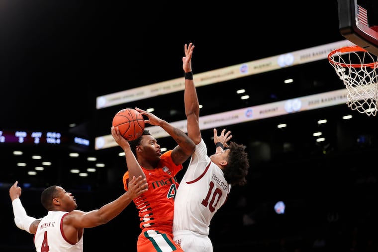 Miami's Keith Stone (4) shoots over Temple's Jake Forrester (10) during the first half of an NCAA college basketball game at Barclays Center, Tuesday, Dec. 17, 2019, in New York. (AP Photo/Michael Owens)