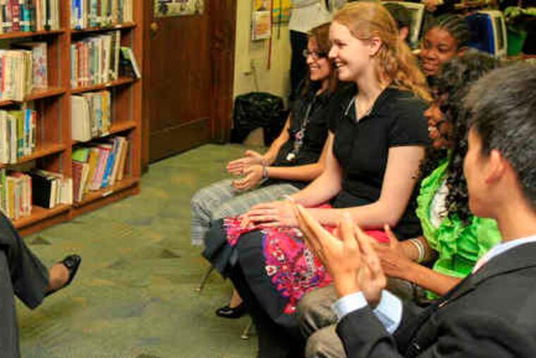 Former Secretary of State Condoleezza Rice speaks with Susanna Concilio, a student world affairs council member. Education "is a chance to find out who you are, and make yourself into something you might never ever have been," Rice told students.