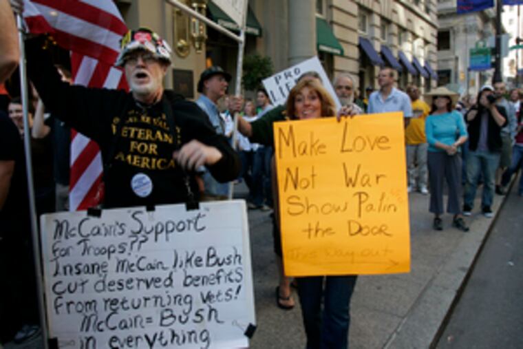 Protesters outside the Park Hyatt at the Bellevue maketheir voices heard as Sarah Palin arrives for a fund-raiser.