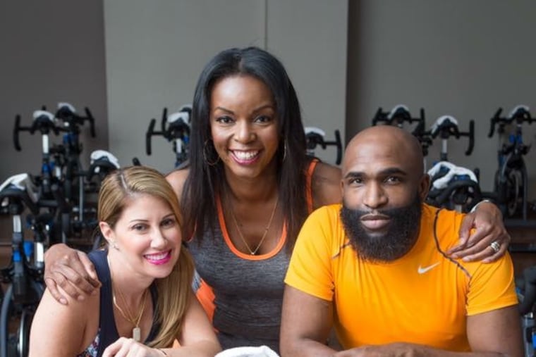 From left to right: Mindie Barnett of MB & Associates PR, Inquirer columnist Jenice Armstrong, and celebrity fashion stylist Anthony Henderson-Strong pose during a 2017 singles photo shoot at Lifetime Fitness in Fort Washington, Pa.