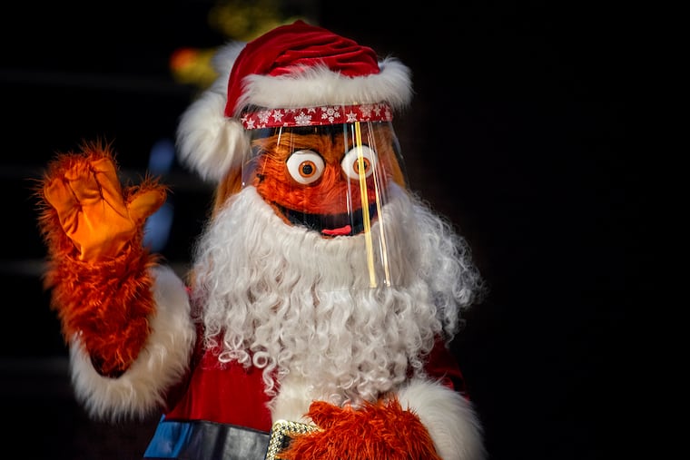 Gritty Claus appears during a media preview Nov. 24, 2020, for the Wells Fargo Center's new "Winter on Broad Street Spectacular" which will run from Nov. 27 through Jan. 3. The socially-distanced, timed, and masked event will feature 193 light sculptures and displays powered by more than a half-million light bulbs; food & beverage options; a craft market, curling, and photos with the Orange Kris Kringle (for an extra $15 for up to six people).