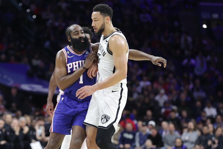 James Harden (left) of the Sixers collides with Ben Simmons of the Nets during a game at the Wells Fargo Center on Jan. 25.
