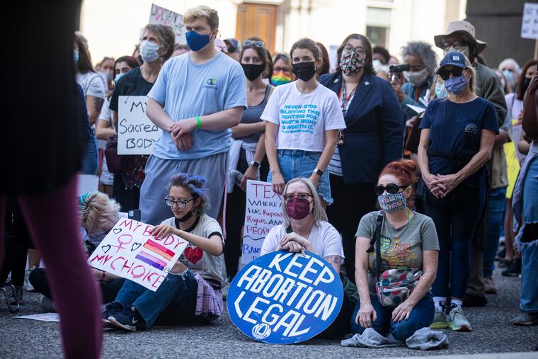 People gather around City Hall for the 2021 Women’s March to stand up for abortion rights in Philadelphia in October.