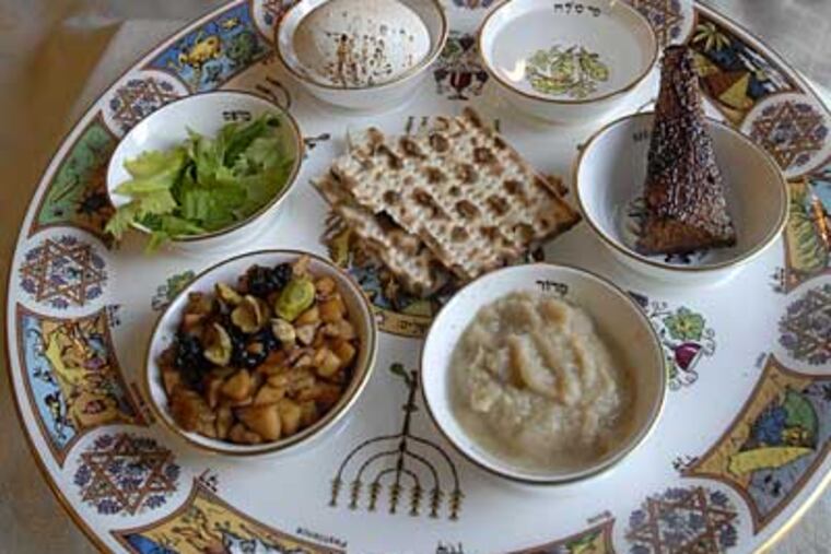 Taking its place at the seder is an Iranian-Israeli haroset (lower left), Joan Nathan’s favorite, made of pears and apples. (Staff photograph by APRIL SAUL; photo styling by CATHY GOLD)