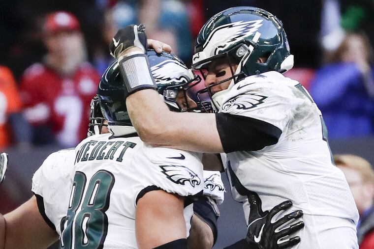 Dallas Goedert Carson Wentz celebrate Goedert's second-quarter touchdown on Sunday.
