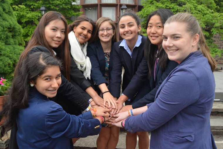 From left, the Hill School students who will travel to Turkey as part of the Give A Hand program: Geeta Sharma, Shirley Ye, Rachel Filzen, Esther Ochoa, Hulya Kösematoglu, Cathy Wang, and Tanya Robinson. Kösematoglu started Give A Hand last year.