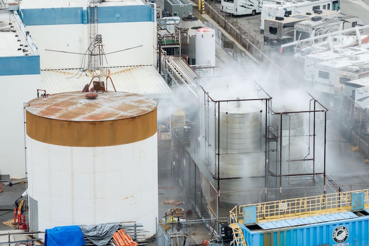 Water is sprayed on a damaged tank at GKN Aerospace in Garden Grove, Calif., on Sunday, May 24, 2026, after the tank containing a chemical used to make plastic parts overheated Thursday.