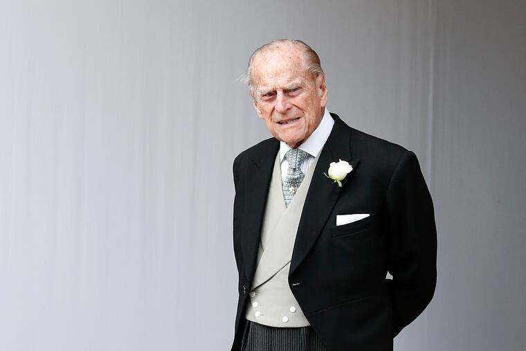 FILE - In this Friday, Oct. 12, 2018 file photo, Britain's Prince Philip waits for the bridal procession following the wedding of Princess Eugenie of York and Jack Brooksbank in St George's Chapel, Windsor Castle, near London, England. Buckingham Palace said Saturday Feb. 9, 2019, that 97-year-old Prince Philip has decided to stop driving, less than a month after he was involved in a collision that left two women injured.