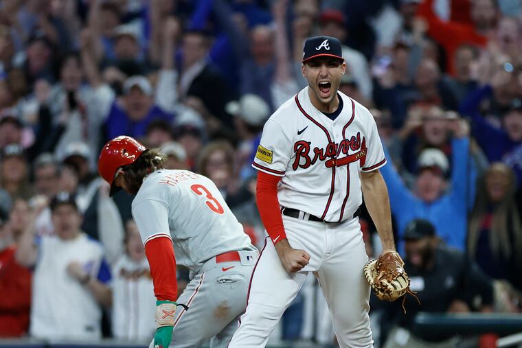 Braves first baseman Matt Olson celebrates after Bryce Harper was doubled up at first base to end Game 2.